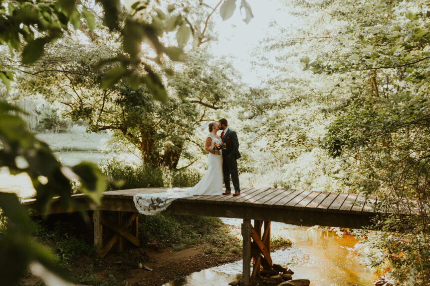 Newlyweds Embrace on Bridge: A Moment of Love
