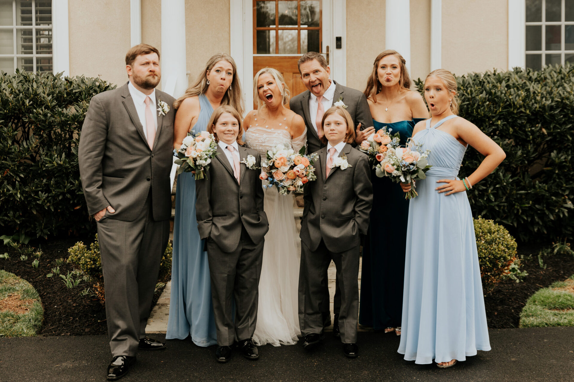 Zion Springs Real Wedding bride and groom with wedding party pulling goofy faces