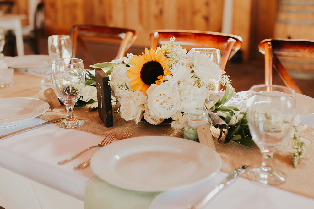Classic wedding reception table decor at Zion Springs, a rustic, elegant barn wedding venue in Northern Virginia.