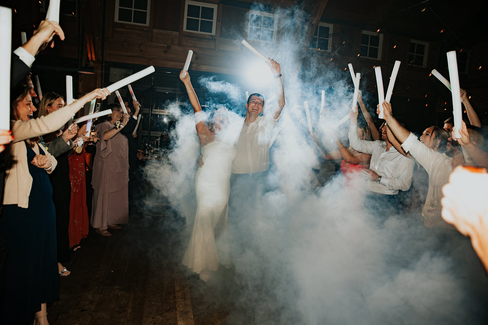 Newlyweds light saber send off after their wedding reception at Zion Springs, an all-inclusive wedding venue in Northern Virginia.