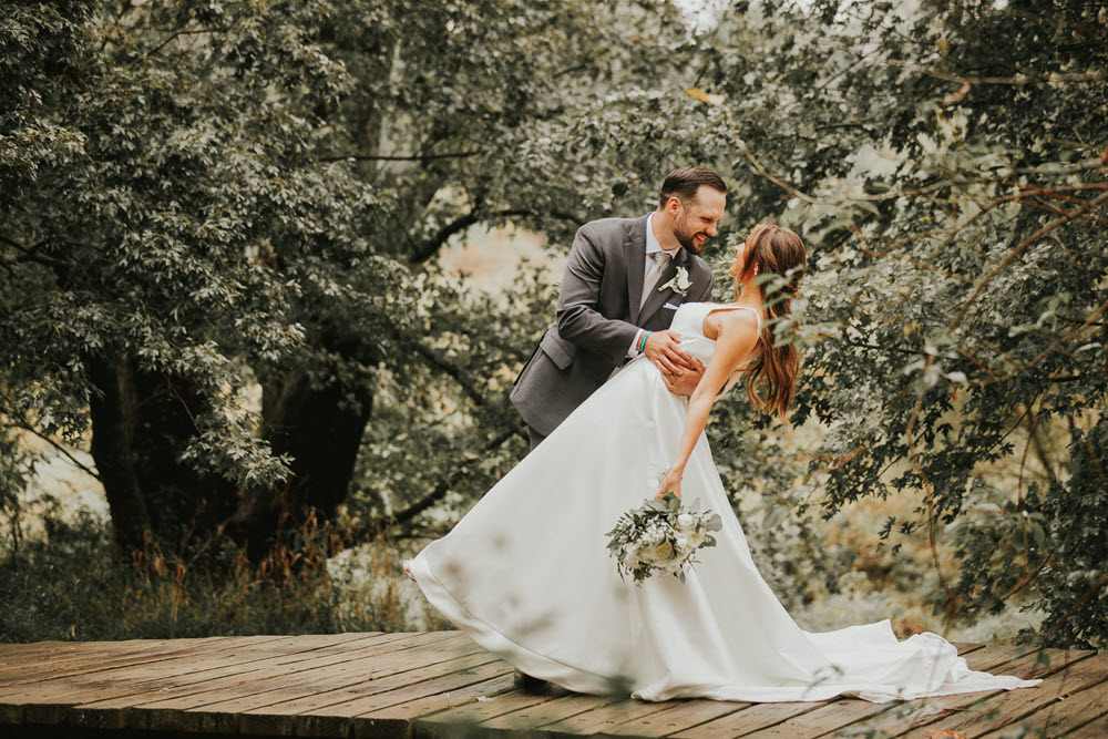 Bridal couple at Zion Springs, loving the magical ambiance of Virginia's premier wedding location.